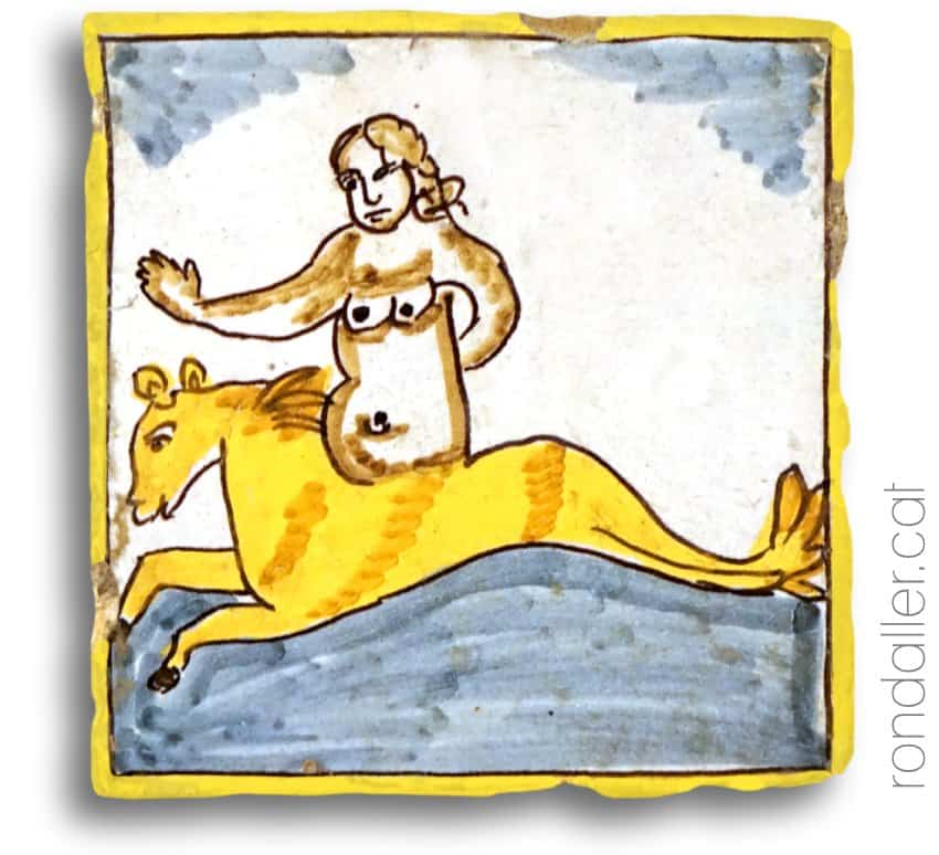 Taulel amb la imatge d'una dona nua muntada a cavall.