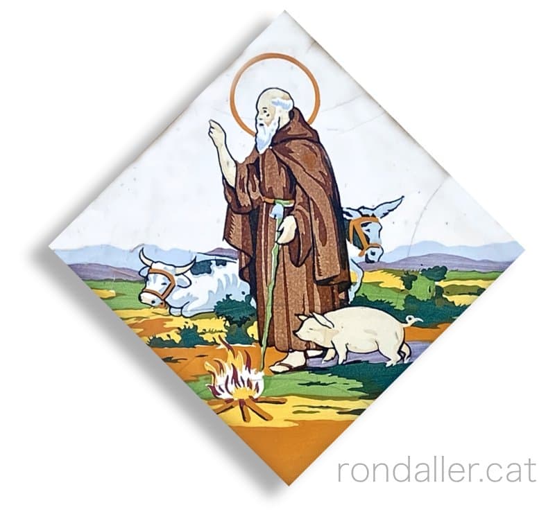 Vides de Sants. Rajola amb la imatge de sant Antoni Abat.